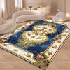 A blue and cream floral patterned rug in a living room setting with light-colored furniture.