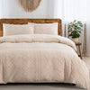 A beige boho tufted microfiber duvet cover set displayed on a wooden bed with sheer curtains and a potted plant.