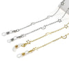A delicate gold and silver necklace featuring star and crescent moon charms.