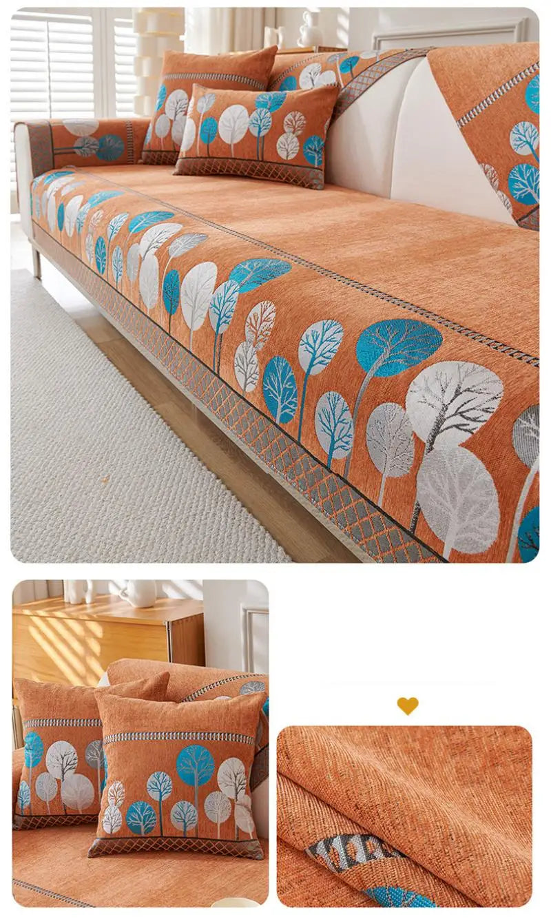 An orange jacquard sofa seat and back cover featuring a pattern of blue, white, and green leaves.