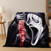 A black and white graphic featuring a hand holding a mask of a screaming horror character on a flannel throw blanket.