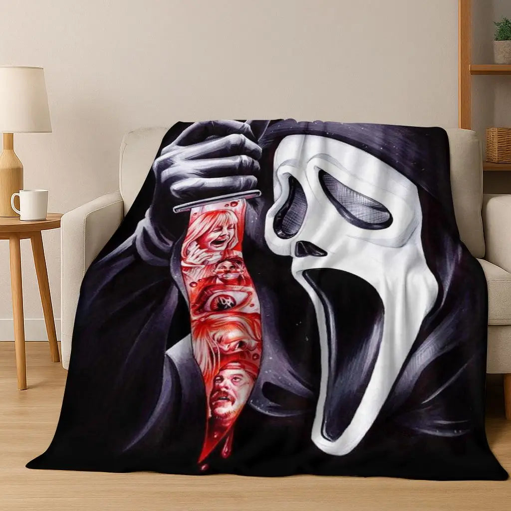 A black and white graphic featuring a hand holding a mask of a screaming horror character on a flannel throw blanket.