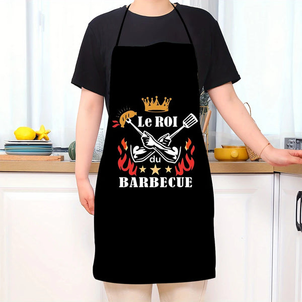Black unisex kitchen chef apron featuring a graphic design with a crown and barbecue theme.