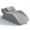 A gray memory foam wedge pillow designed for back support and leg elevation.