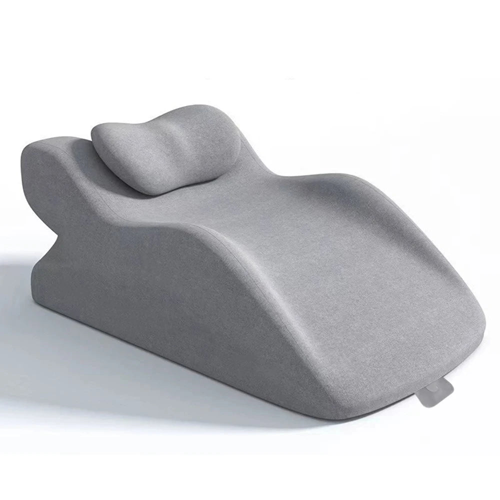 A gray memory foam wedge pillow designed for back support and leg elevation.