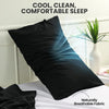 Black microfiber pillow covers shown on a bed with natural light, emphasizing cool and comfortable sleep.