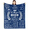 A dark blue fleece blanket featuring white text in Spanish celebrating a son and father relationship