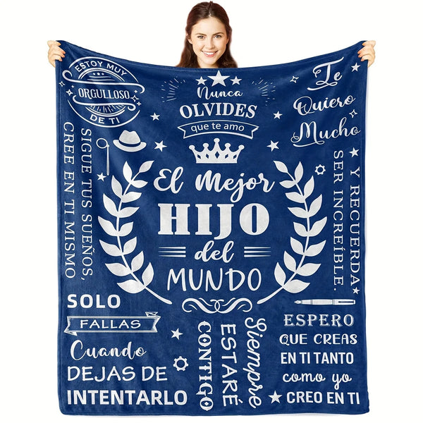 A dark blue fleece blanket featuring white text in Spanish celebrating a son and father relationship