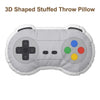 A gray 3D shaped stuffed throw pillow designed like a video game controller.