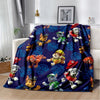 A dark blue flannel throw blanket featuring a repeating pattern of cartoon dogs in various poses.
