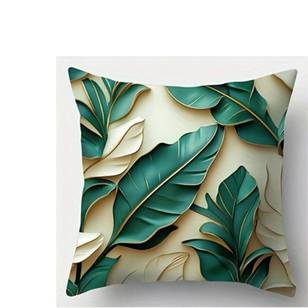 A decorative pillow featuring a botanical leaf print in shades of teal and cream.