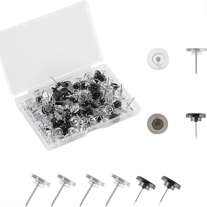 A clear plastic box containing a pack of transparent round head push pins and various pin types.