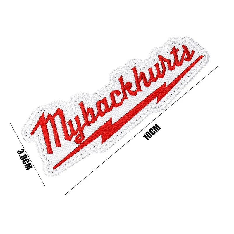 White embroidered patch with red text Mybackhurts and a lightning bolt design on a white background