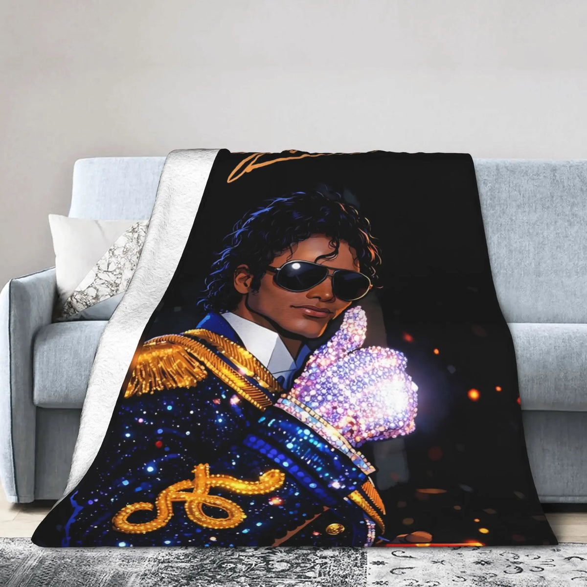 A dark graphic print featuring a person in a blue suit with gold accents and sparkling light effects on a soft throw blanket.