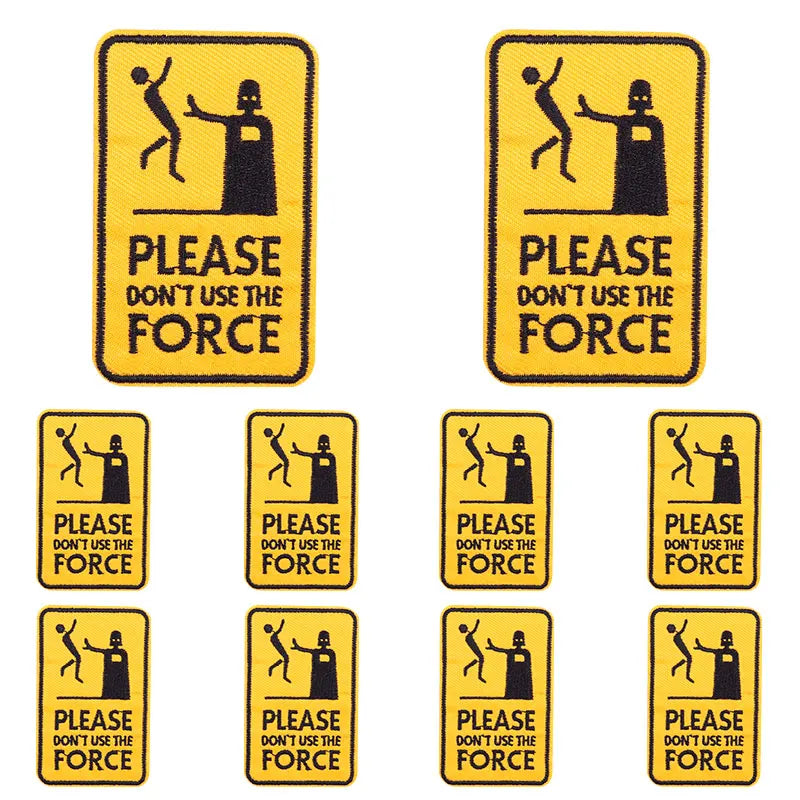 A set of eight embroidered letter Slogan applique patches with the text Please don't use the force on a yellow background.
