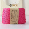 Pink bamboo fiber yarn skein labeled as 08 Home Yarn.