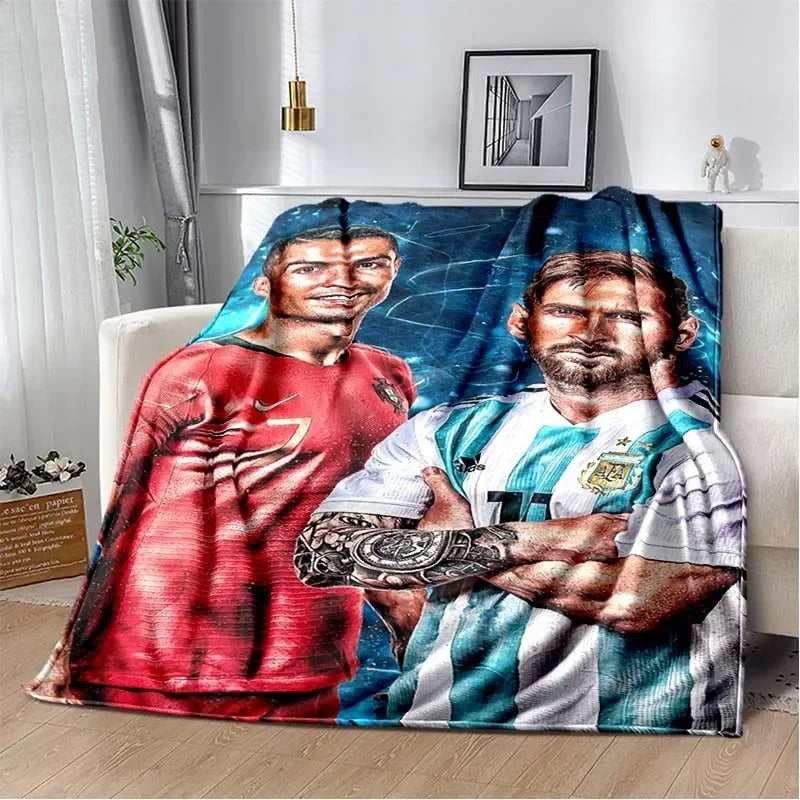 A large fabric blanket featuring two male soccer players in red and white jerseys against a blue background.