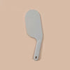 A white bed sheet folding and organizing tool with a curved blade and handle.