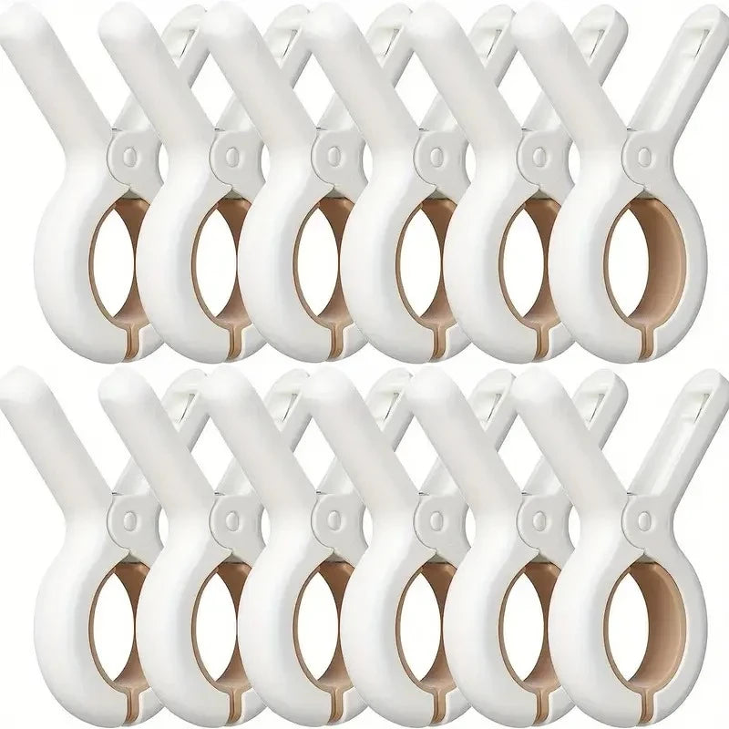 A row of white heavy-duty plastic clothespins with rust-resistant springs.