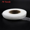 Roll of white double-sided fabric interlining tape, 70 yards long.