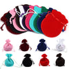 A set of ten velvet drawstring gift bags in various colors including pink, purple, green, blue, and red.