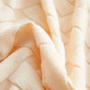 Soft peach jacquard plush sofa cushion cover fabric with a quilted texture