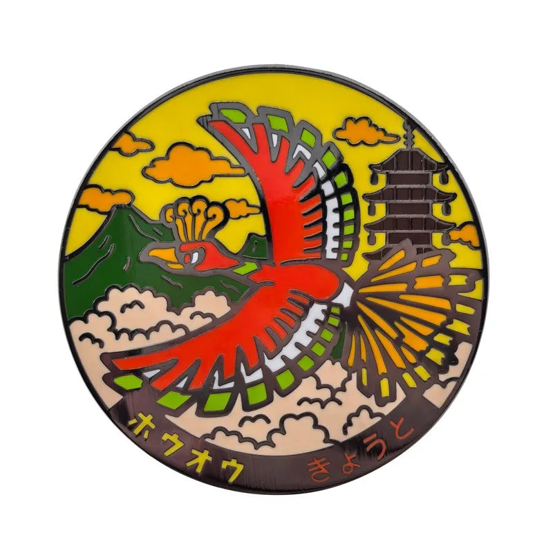 A round enamel pin featuring a stylized red and orange bird with yellow accents on a yellow background.