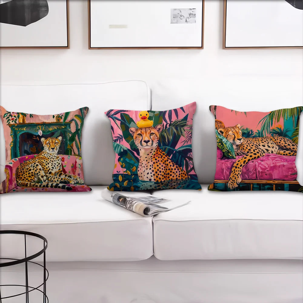 A collection of colorful cushion covers featuring cheetahs and tropical plants displayed on a white sofa.