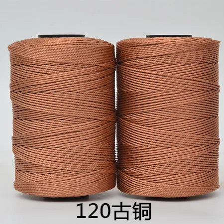 Two spools of brown hand knitting and crochet cord for crafting