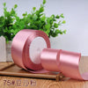 Roll of pink satin ribbon for gift wrapping and DIY crafts