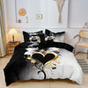 Black and white duvet cover featuring a romantic floral design with gold scroll accents.