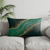 A dark teal pillow cover featuring a flowing geometric pattern of bright green and gold lines.