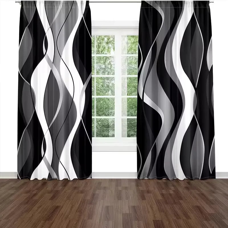 A set of two abstract wavy line curtains in black and white filtering light through a window.