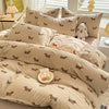 A beige duvet set featuring a cute dog print pattern on the fabric.