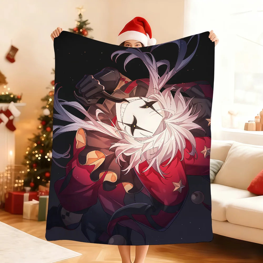 A person holds up a dark purple and red circus theme soft throw blanket featuring an anime-style character with pink hair and