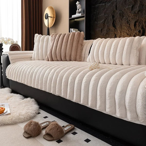 A beige thickened plush sofa seat cushion is shown on a black sofa, with decorative items and natural light in the background