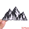 Black and white embroidered mountain range patch on a white background