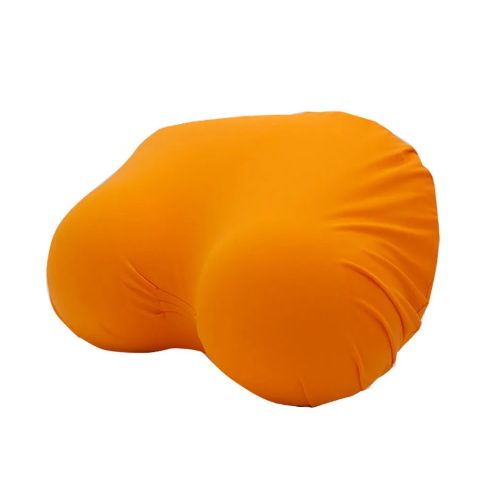 An orange memory foam contour chest pillow shown from the side.