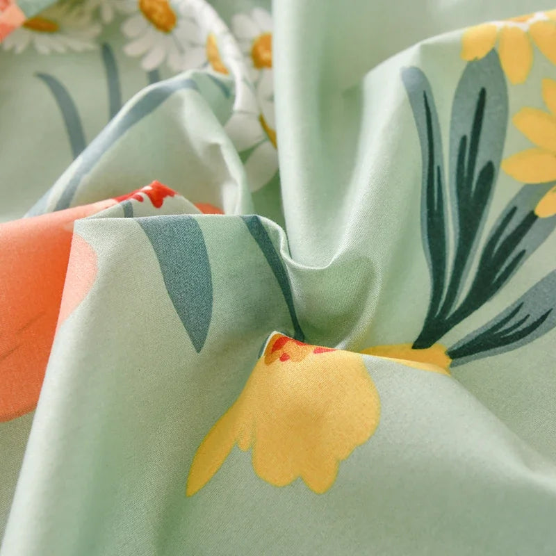 Light green floral fabric draped, showing yellow and gray leaf patterns.