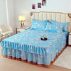 Light blue floral bed skirt with lace trim protecting a mattress on a bed.