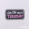 Black embroidery patch with pink text that reads See You Next Tuesday