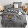 A black and white plaid duvet cover set with a checkered pattern displayed on a bed.