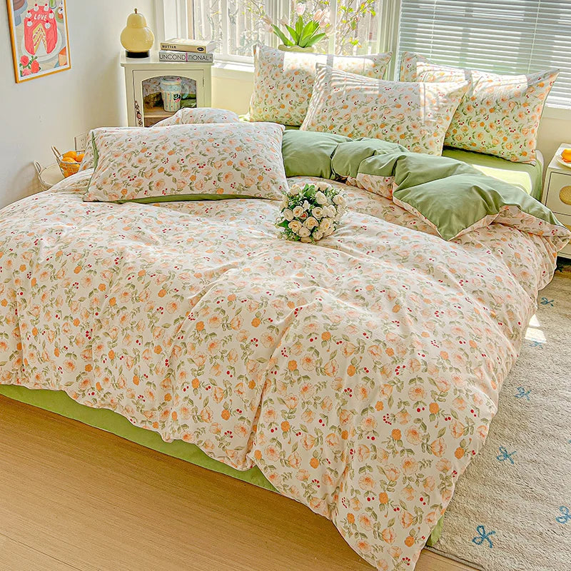 Floral printed bedding set featuring light pink and green patterns on a bed with sheer white blinds.