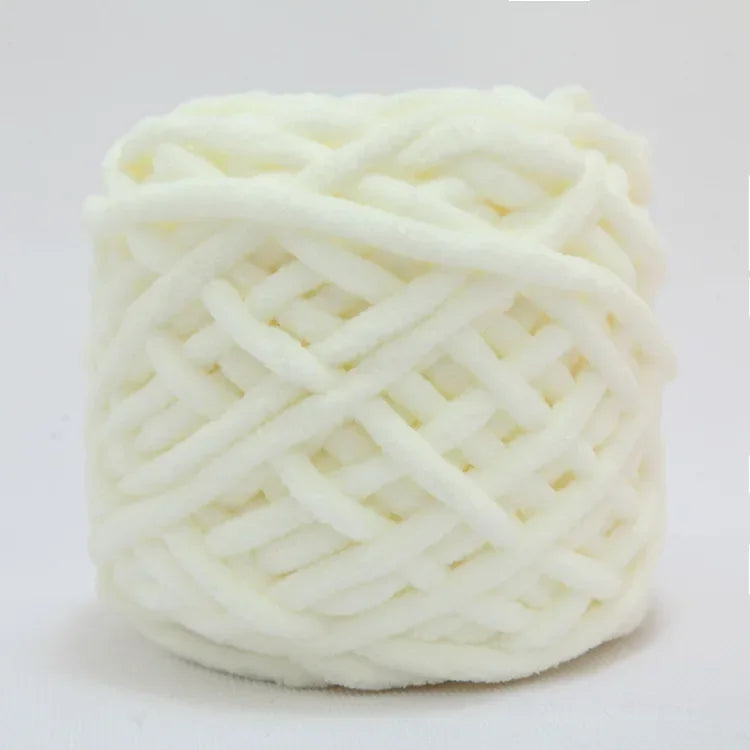 A ball of white soft chenille knitting yarn used for hand crafting.