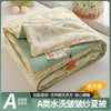 A washable quilt with a cartoon pattern featuring light green and yellow floral designs.