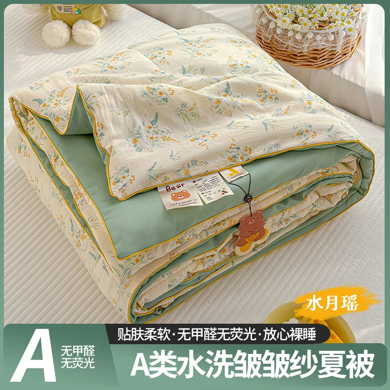 A washable quilt with a cartoon pattern featuring light green and yellow floral designs.