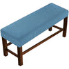 A blue striped elastic stool cover placed on a wooden frame.
