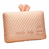A soft peach memory foam neck pillow for toddlers with a decorative bow.