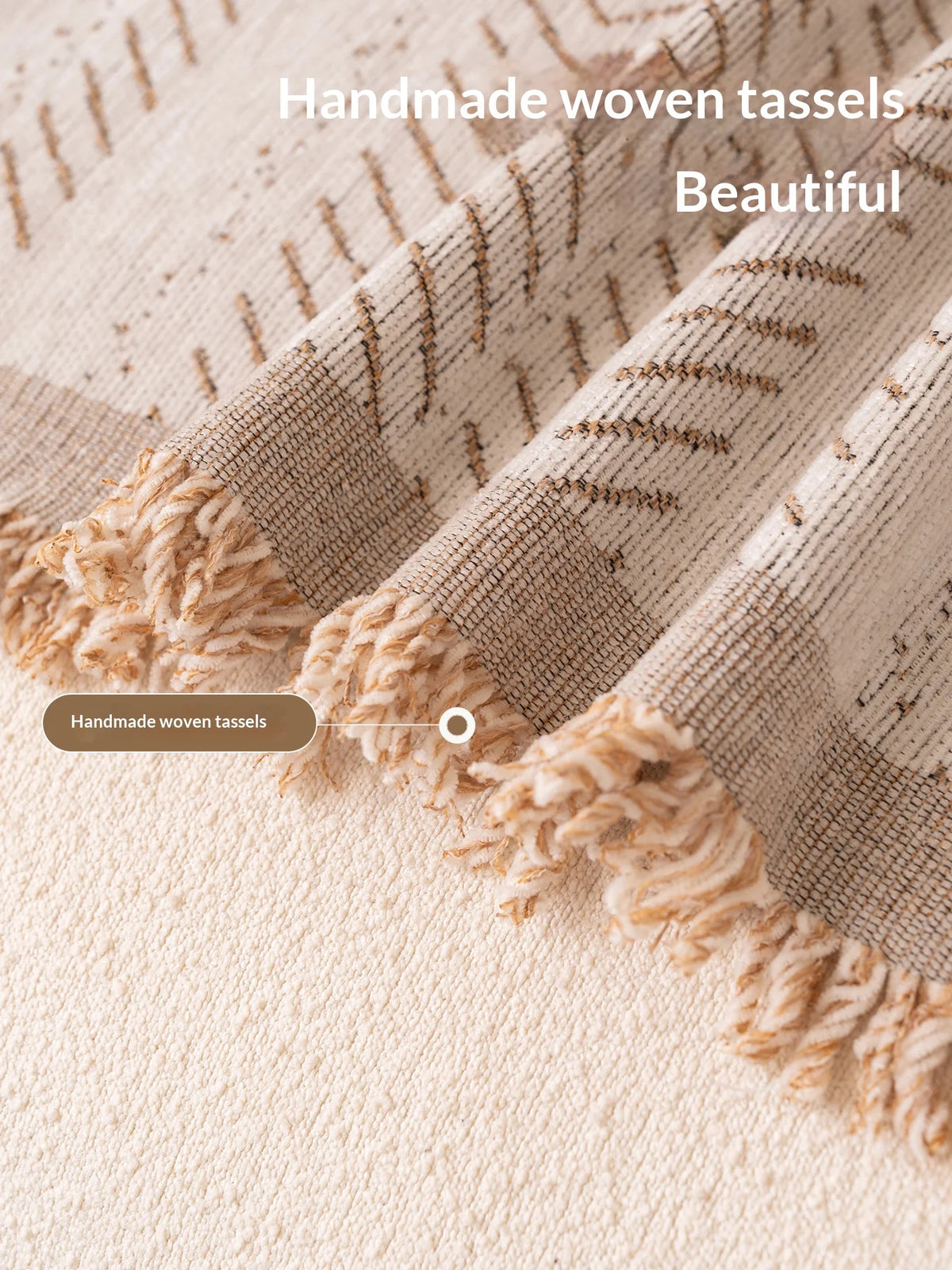 Close-up of a beige woven textile featuring handmade woven tassels and a fishbone pattern.
