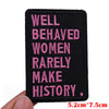 Black embroidered patch with pink text that reads Well Behaved Women Rarely Make History.